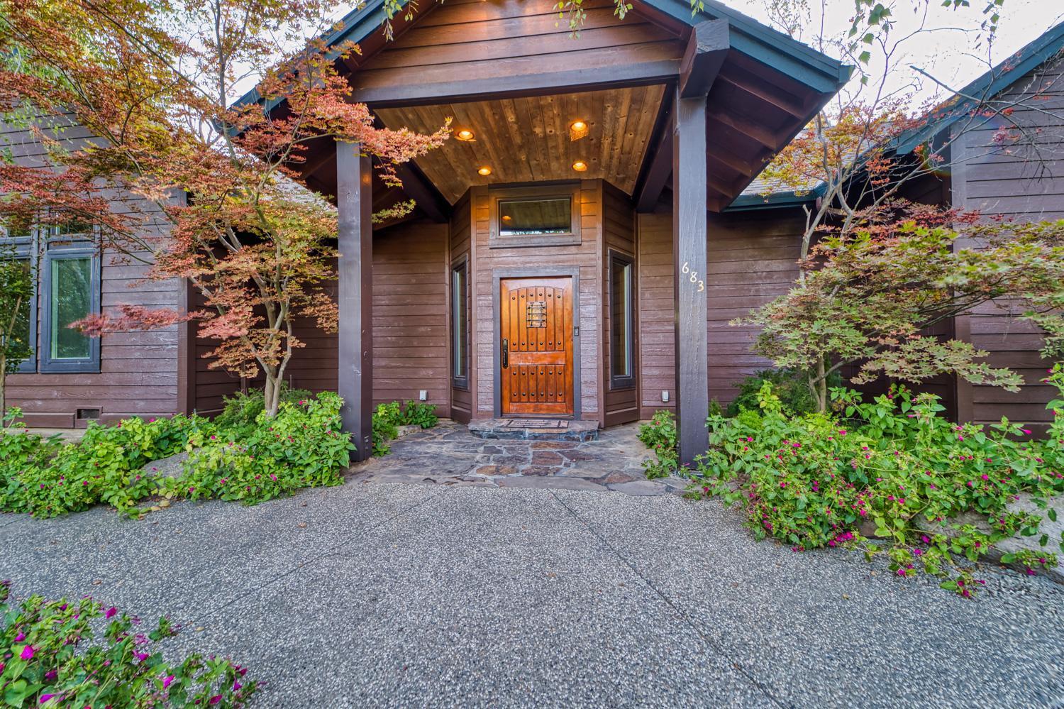 683 Stewart Road Yuba City, CA 95991 - Photo 33 of 55 a front view of a house with garden