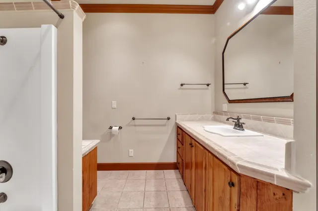 a bathroom with a sink and mirror