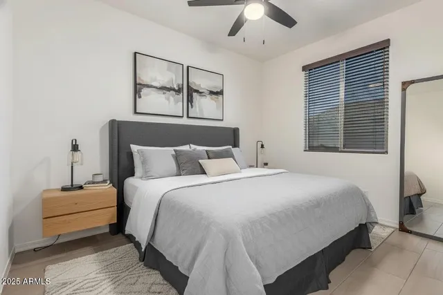 a bathroom with a granite countertop sink toilet and mirror