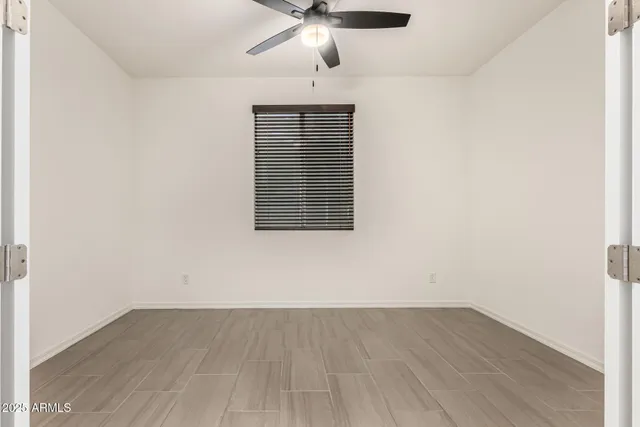 a bedroom with bed and window