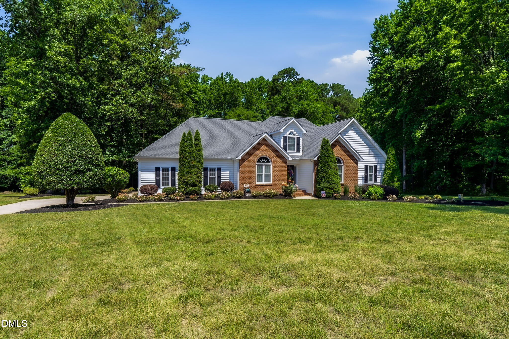 1112 Tyler Farms Drive Raleigh, NC 27603 - Photo 8 of 78 a view of a house with a big yard and large trees