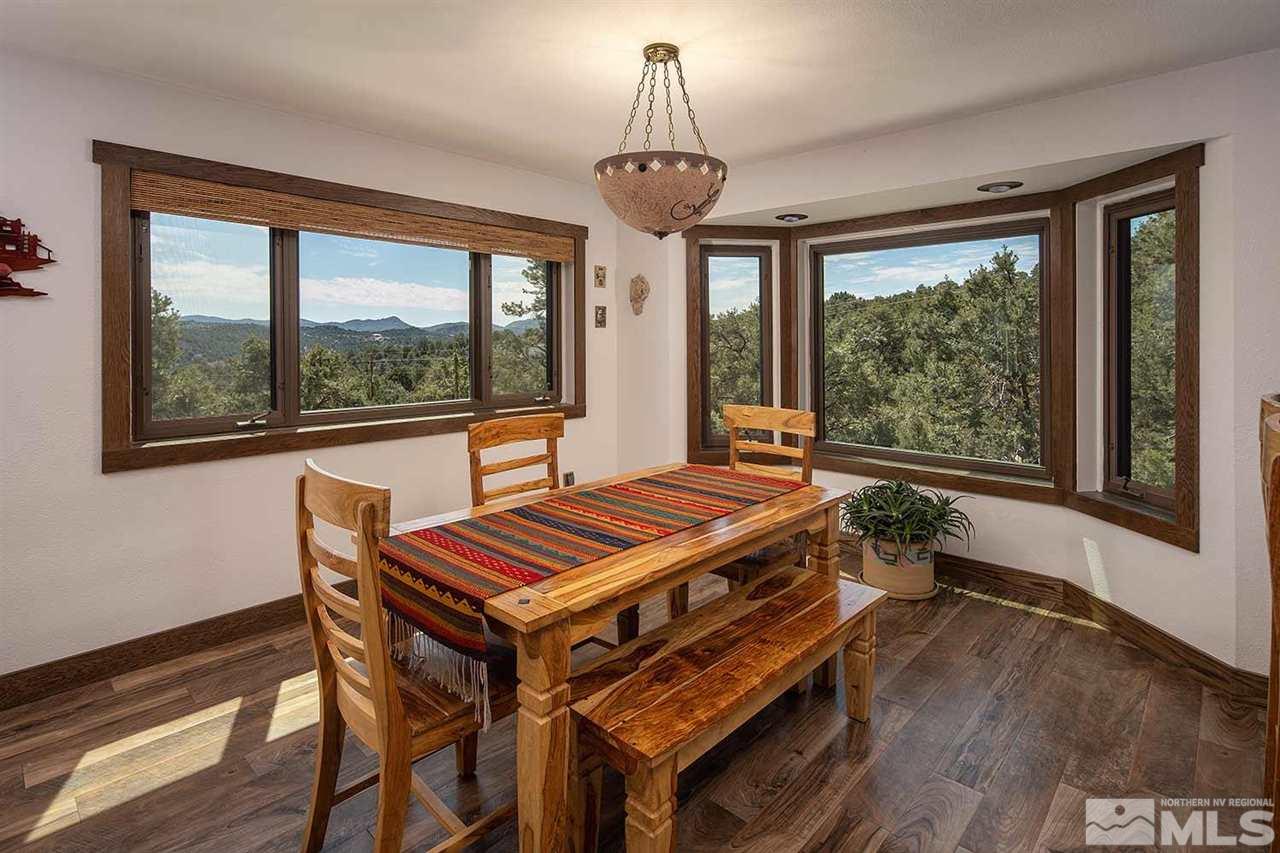 21530 Sazarac Road Reno, NV 89521 - Photo 11 of 30 a living room with a piano and a table