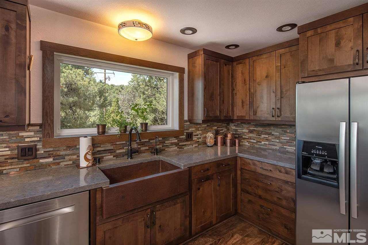 21530 Sazarac Road Reno, NV 89521 - Photo 14 of 30 a kitchen with a sink stove and refrigerator