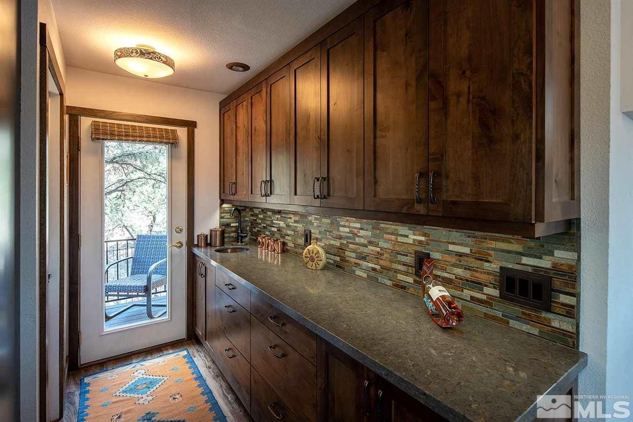 21530 Sazarac Road Reno, NV 89521 - Photo 16 of 30 a view of a kitchen with granite countertop a sink