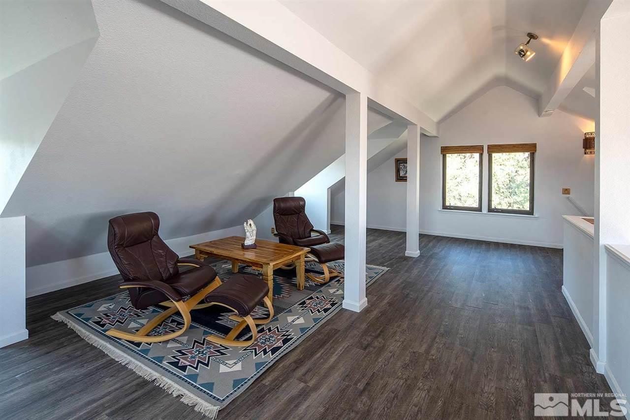21530 Sazarac Road Reno, NV 89521 - Photo 18 of 30 a living room with furniture and a wooden floor