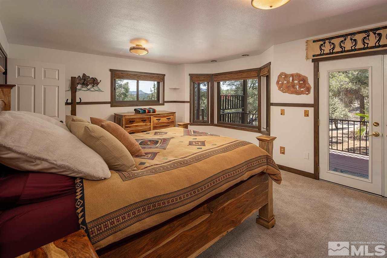21530 Sazarac Road Reno, NV 89521 - Photo 22 of 30 a bed room with a bed and a large window