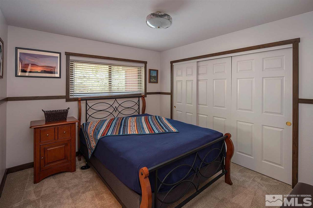 21530 Sazarac Road Reno, NV 89521 - Photo 27 of 30 a bedroom with a bed and a window