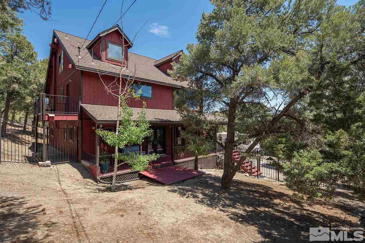 21530 Sazarac Road Reno, NV 89521 - Photo 29 of 30 a view of a house with a yard and sitting area