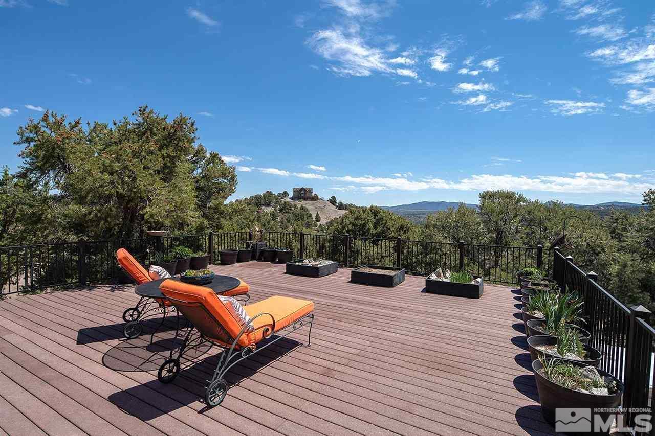 21530 Sazarac Road Reno, NV 89521 - Photo 4 of 30 a view of a terrace with couches and wooden floor