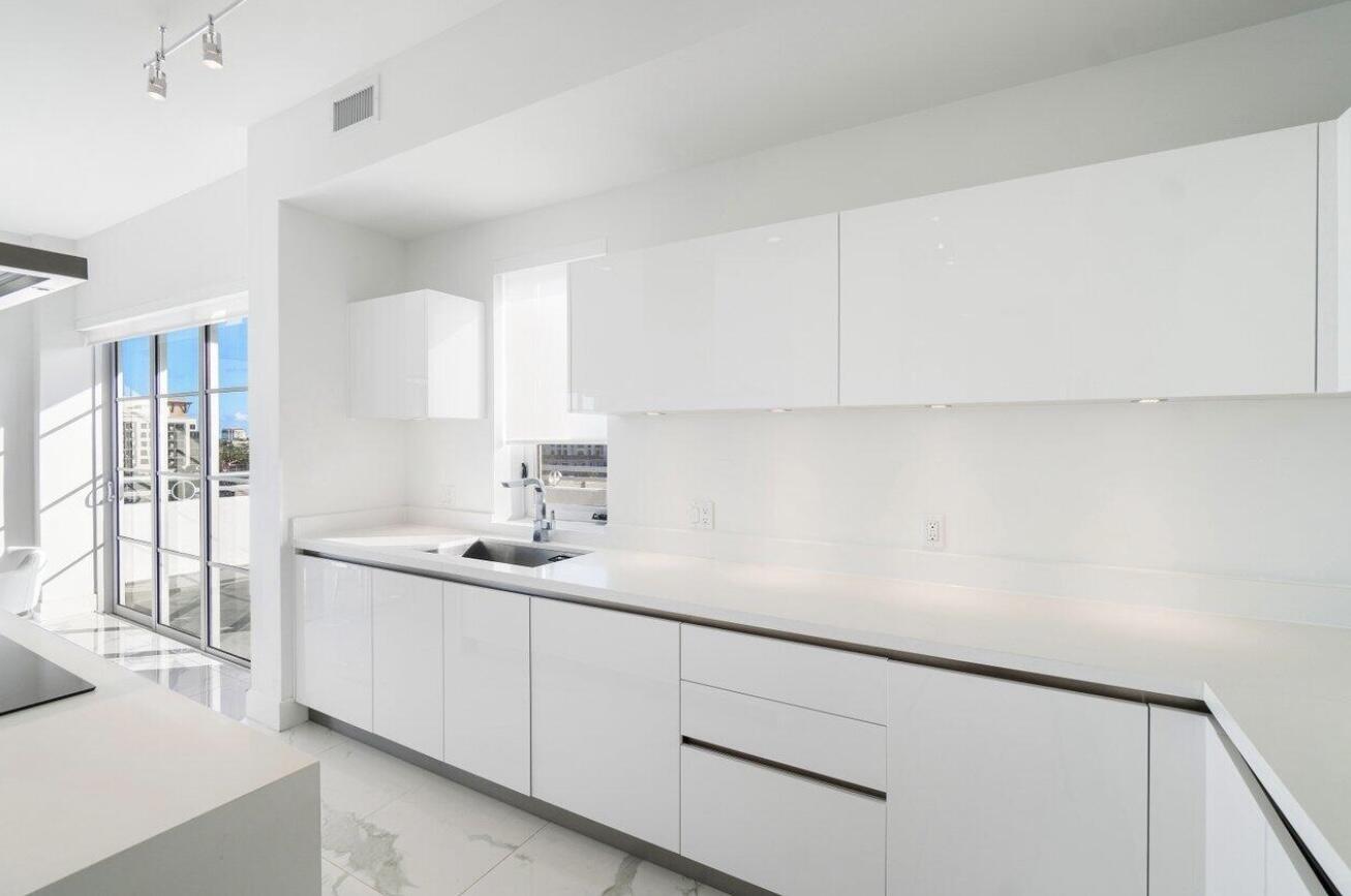 155 East Boca Raton Road, Unit 603 Boca Raton, FL 33432 - Photo 11 of 55 a kitchen with a sink and cabinets
