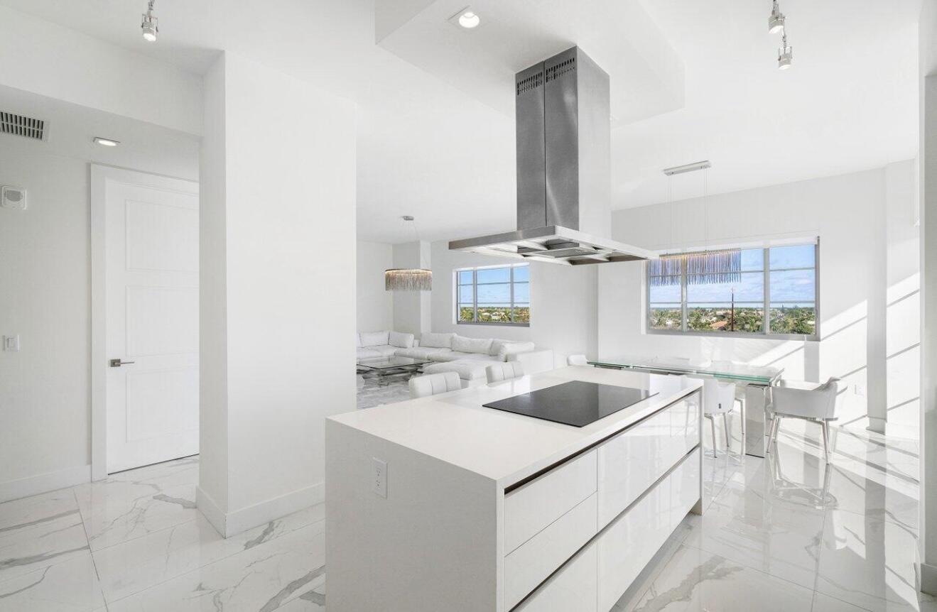 155 East Boca Raton Road, Unit 603 Boca Raton, FL 33432 - Photo 12 of 55 a kitchen with a sink and cabinets