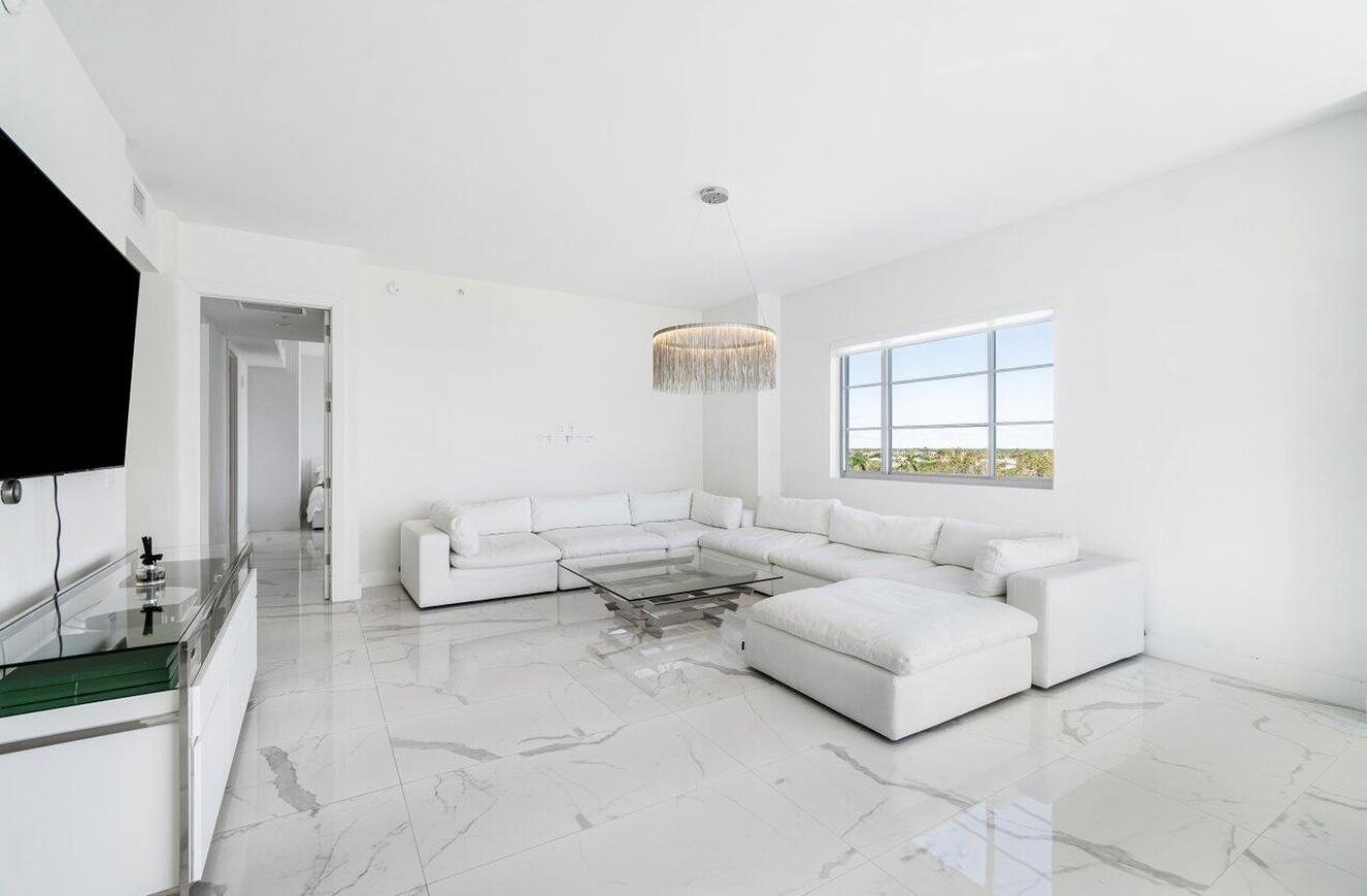 155 East Boca Raton Road, Unit 603 Boca Raton, FL 33432 - Photo 16 of 55 a living room with furniture and a flat screen tv
