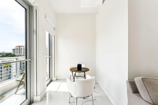 a view of balcony with wooden floor