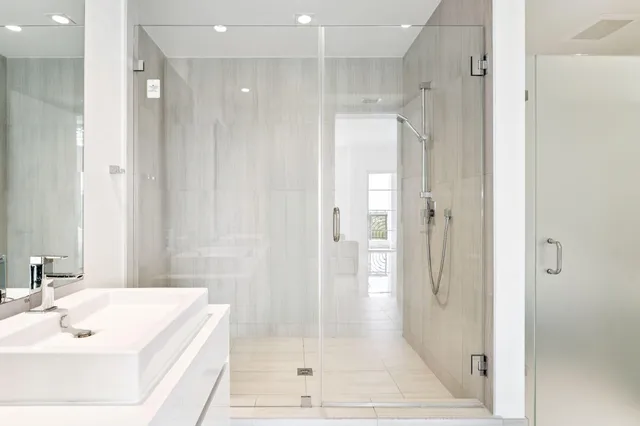 a spacious bathroom with a bathtub and a shower