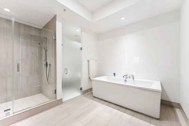 a white bath tub sitting in a bathroom
