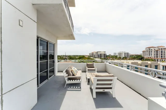 a view of a terrace with furniture
