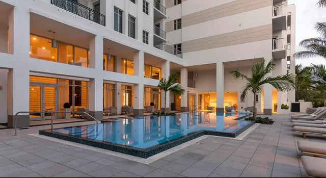 a view of a chairs and table in patio