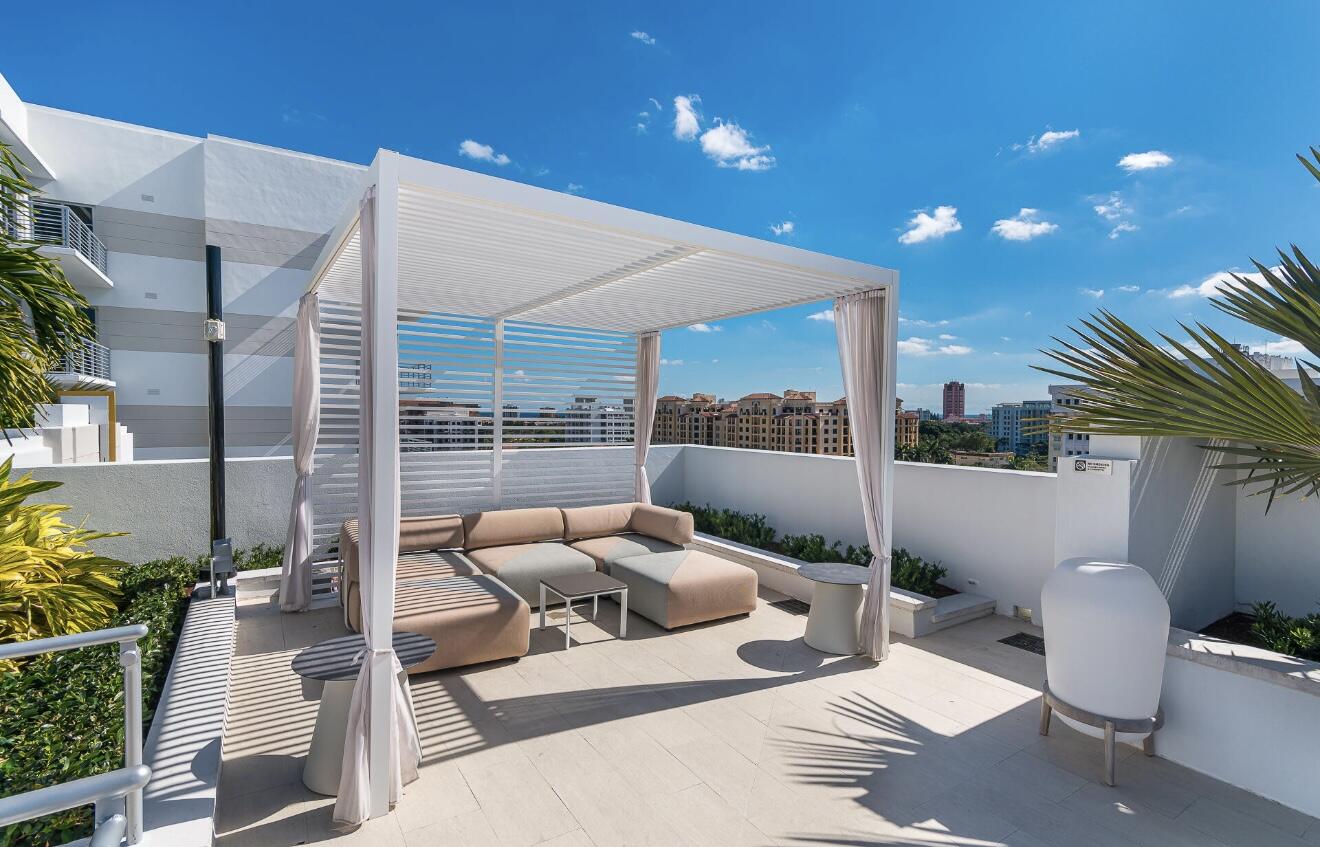 155 East Boca Raton Road, Unit 603 Boca Raton, FL 33432 - Photo 40 of 55 a building outdoor space with patio furniture and potted plants