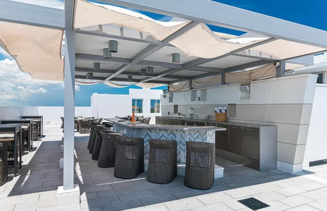 a living room with fireplace furniture and a flat screen tv