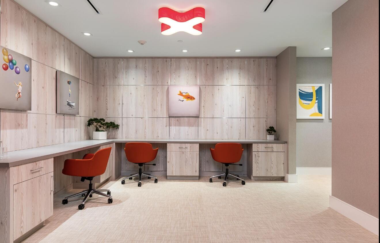 155 East Boca Raton Road, Unit 603 Boca Raton, FL 33432 - Photo 50 of 55 a workspace with a table chair and wooden floor