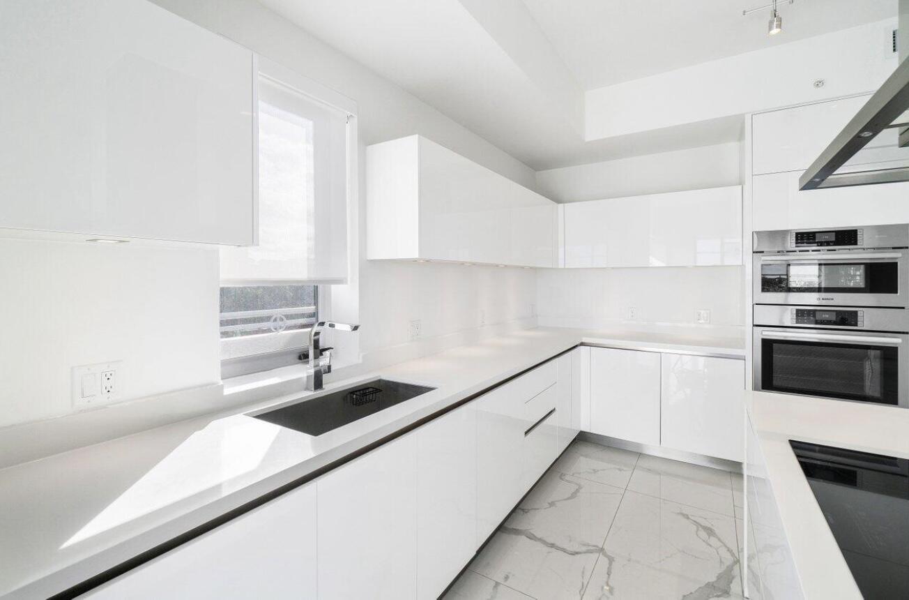 155 East Boca Raton Road, Unit 603 Boca Raton, FL 33432 - Photo 10 of 55 a kitchen with a sink and a stove