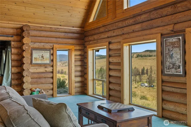 a outdoor living space with patio furniture and a fireplace