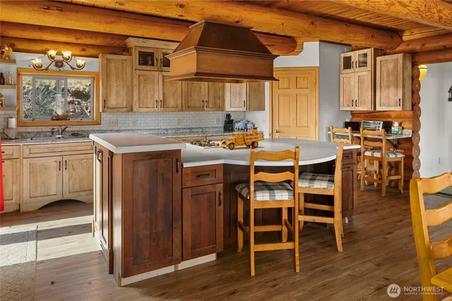 a kitchen with a stove and a refrigerator