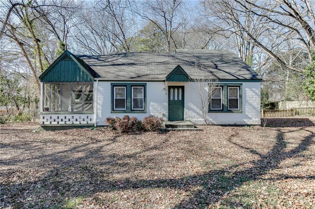 1684 Cooledge Road Tucker, GA 30084 - Photo 1 of 1 a front view of a house with a yard and garage