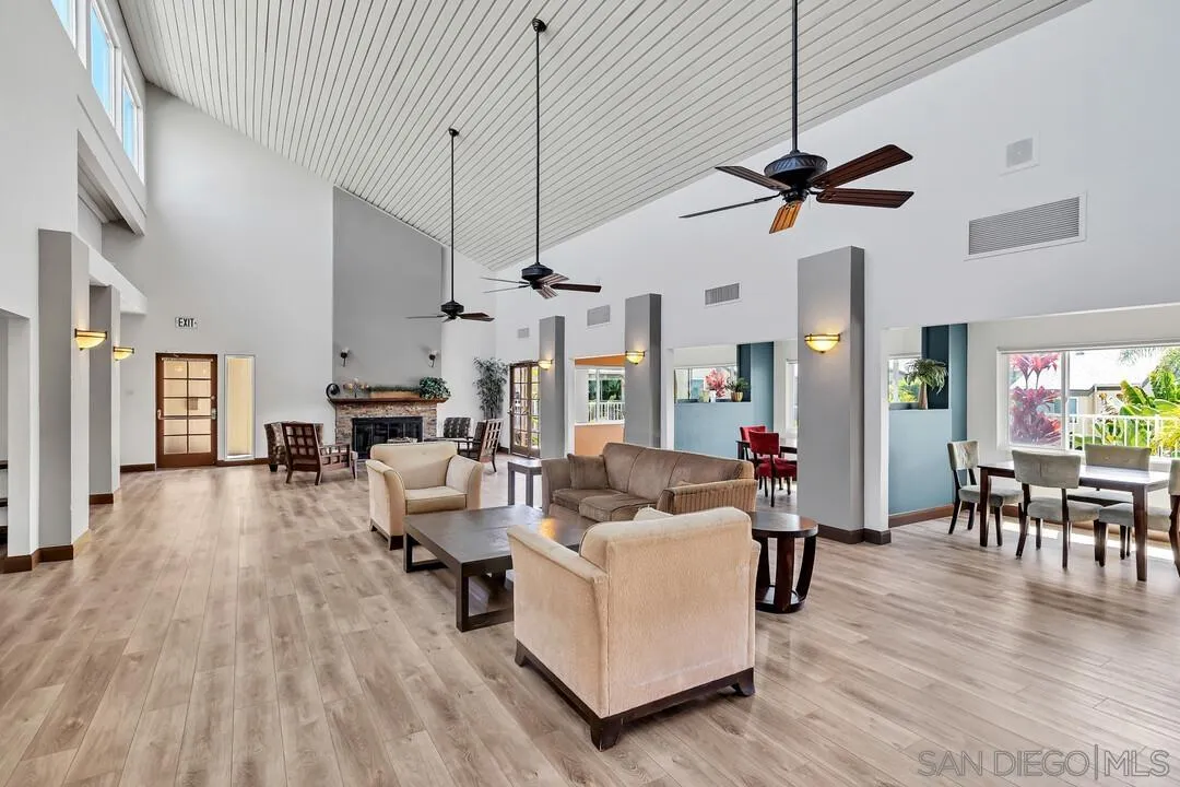 8524 Via Mallorca, Unit C La Jolla, CA 92037 - Photo 29 of 36 a living room with furniture and a wooden floor