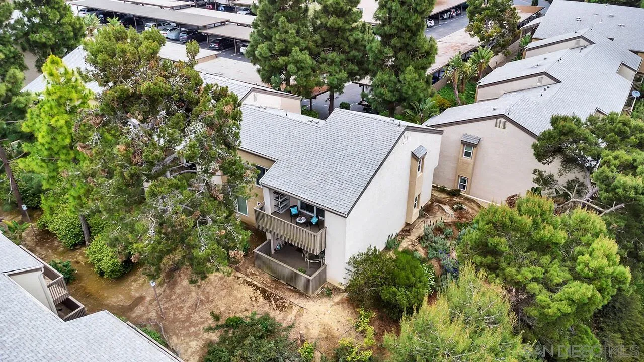 8524 Via Mallorca, Unit C La Jolla, CA 92037 - Photo 30 of 36 an aerial view of a house with a yard and trees