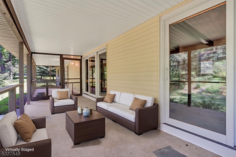 41 Cherryville Hollow Road Flemington, NJ 08822 - Photo 15 of 48 a living room with furniture and a floor to ceiling window