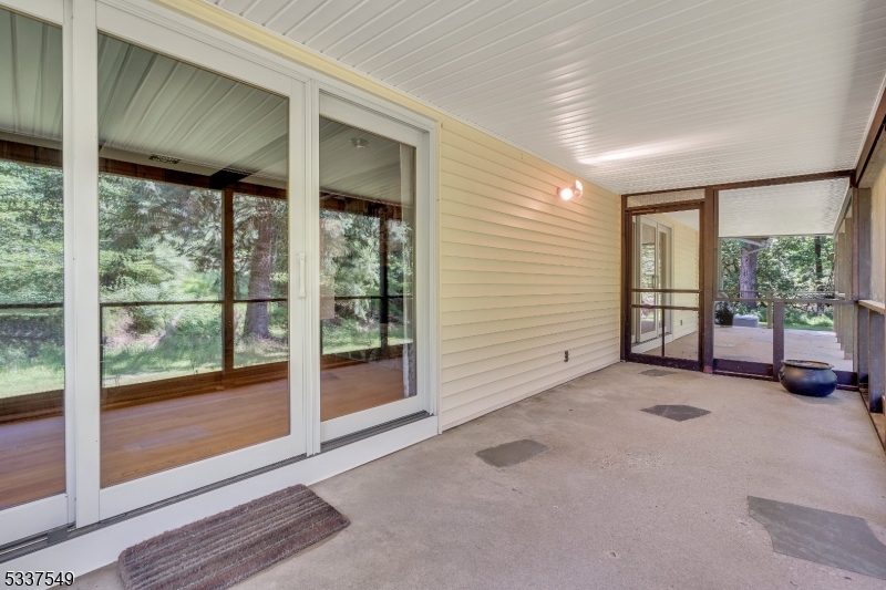 41 Cherryville Hollow Road Flemington, NJ 08822 - Photo 17 of 48 a view of an empty room with wooden floor and windows