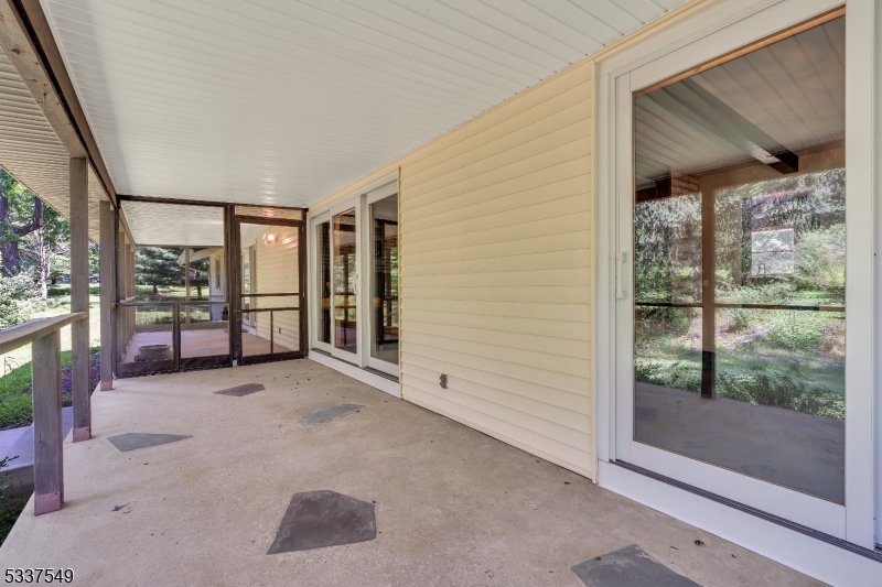 41 Cherryville Hollow Road Flemington, NJ 08822 - Photo 18 of 48 a view of a hallway with wooden floor and a fireplace