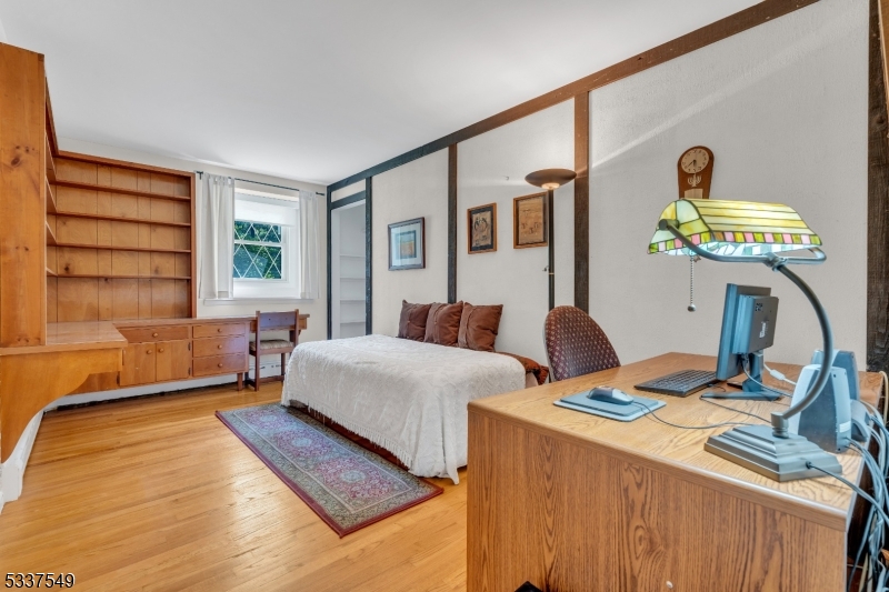 41 Cherryville Hollow Road Flemington, NJ 08822 - Photo 34 of 48 a bedroom with a bed and a chandelier