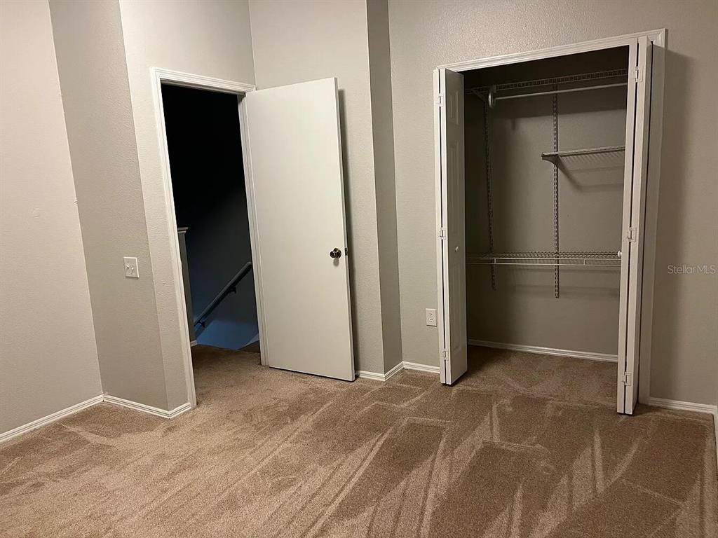 8674 Hunters Key Circle Tampa, FL 33647 - Photo 12 of 16 an empty room with closet and a bathroom
