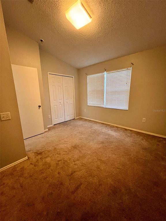 8674 Hunters Key Circle Tampa, FL 33647 - Photo 13 of 16 an empty room with windows