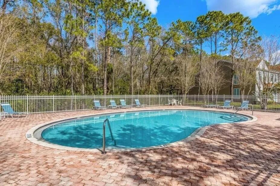 8674 Hunters Key Circle Tampa, FL 33647 - Photo 2 of 16 a view of a swimming pool with a backyard