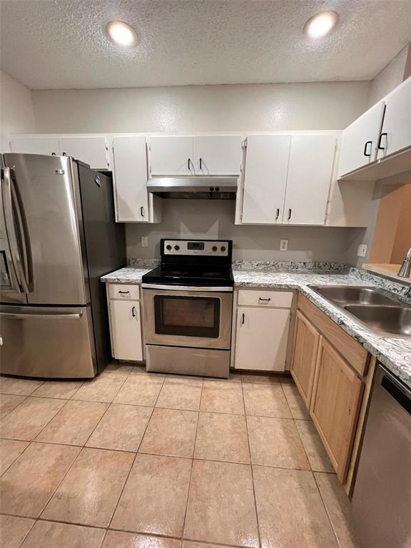 8674 Hunters Key Circle Tampa, FL 33647 - Photo 3 of 16 a kitchen with stainless steel appliances granite countertop a stove a sink and a refrigerator