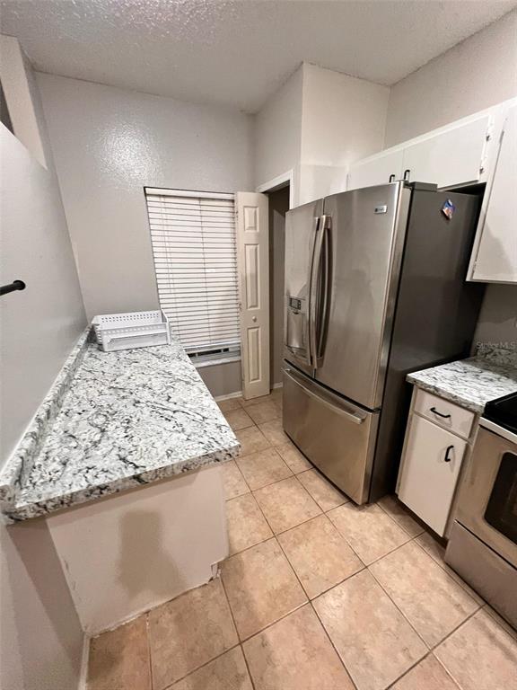 8674 Hunters Key Circle Tampa, FL 33647 - Photo 4 of 16 a kitchen with stainless steel appliances granite countertop a refrigerator and a sink