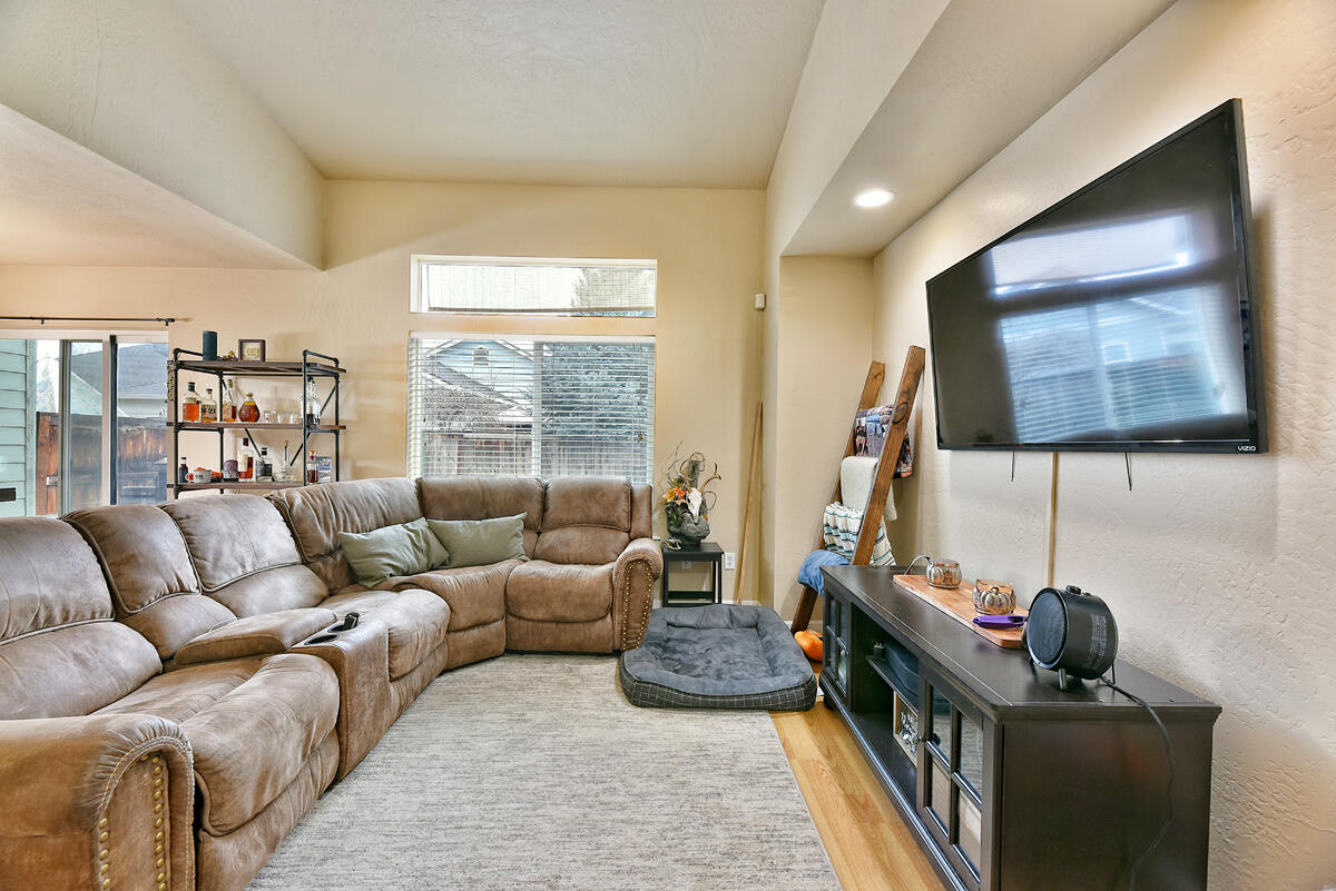 328 Live Oak Loop Central Point, OR 97502 - Photo 4 of 18 a living room with furniture and a flat screen tv