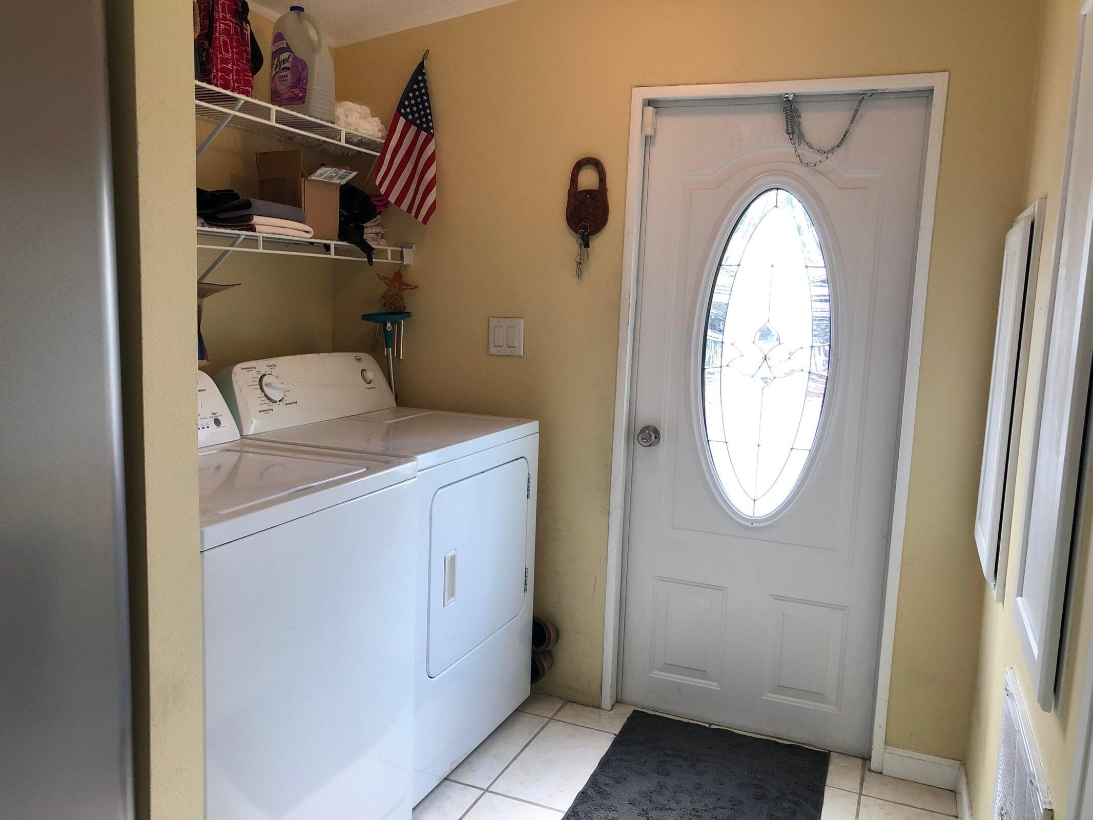 11945 Flotilla Place Boca Raton, FL 33428 - Photo 6 of 17 a utility room with dryer and washer