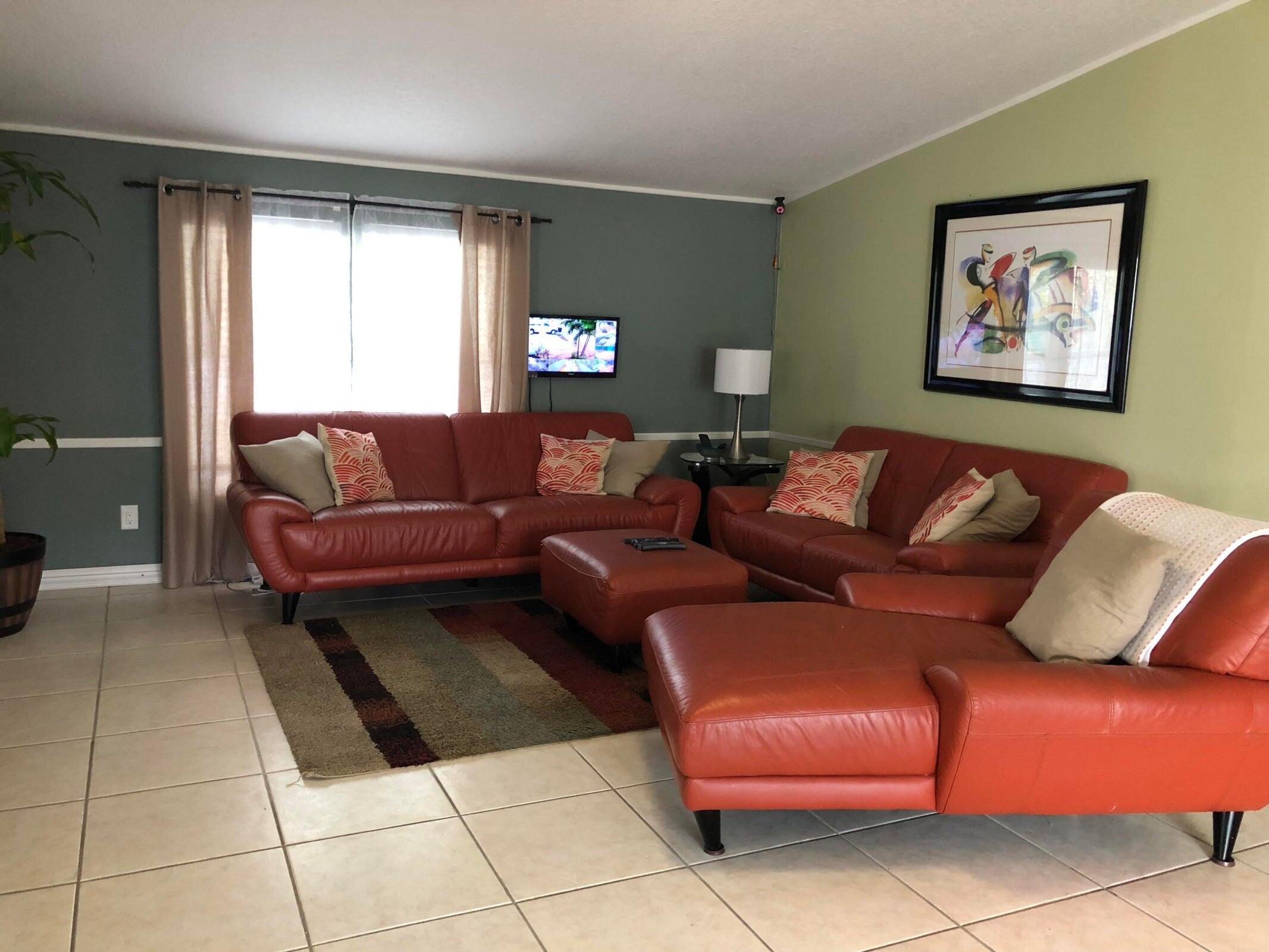 11945 Flotilla Place Boca Raton, FL 33428 - Photo 7 of 17 a living room with a couch and a window