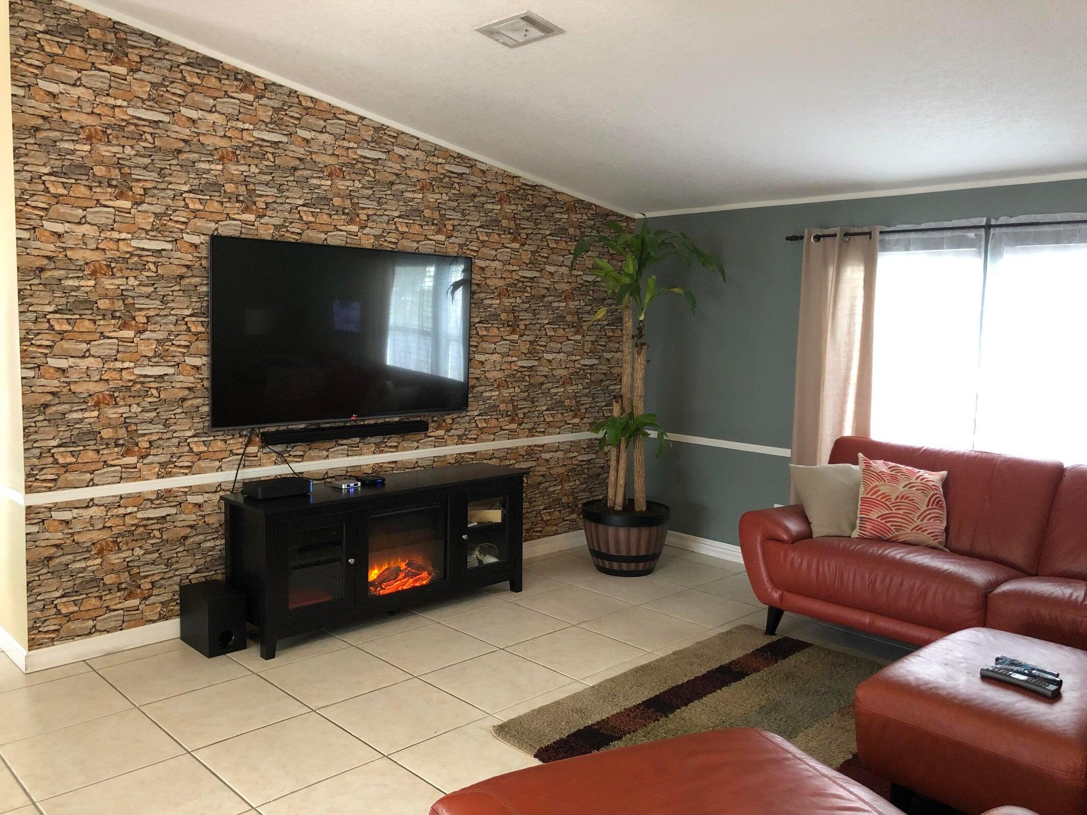 11945 Flotilla Place Boca Raton, FL 33428 - Photo 8 of 17 a living room with furniture and a flat screen tv