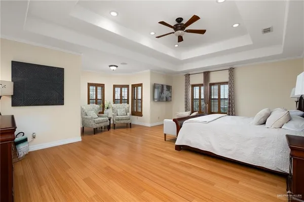 a spacious bedroom with a bed and window