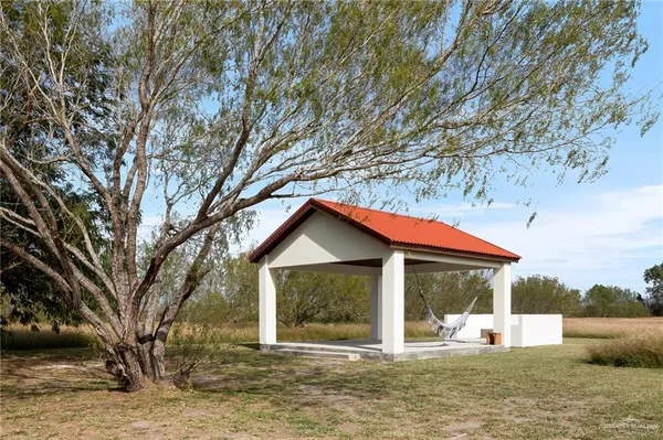 an aerial view of a house with a swimming pool