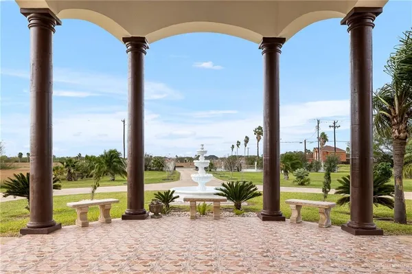 a view of swimming pool with a sitting area