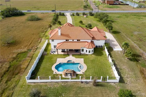 an aerial view of a house with a ocean view