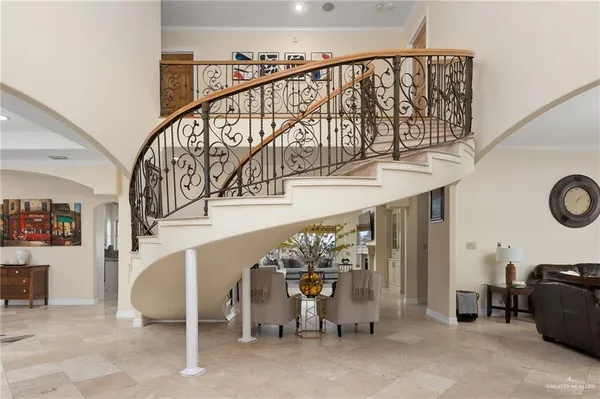 a view of a dining room with furniture and chandelier