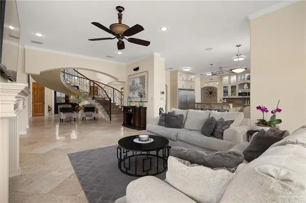 a living room with furniture and a chandelier