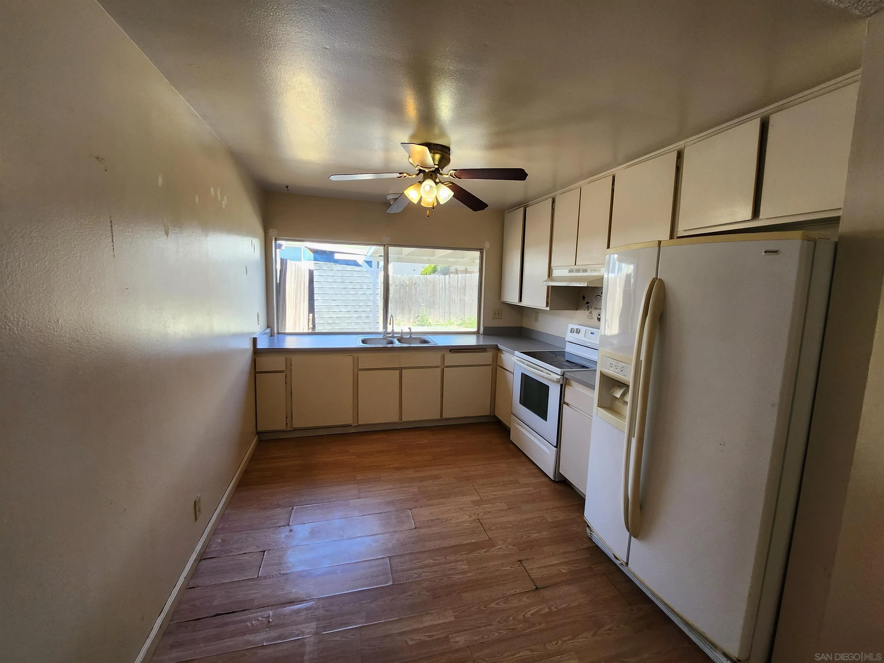 2017 Crofton Street Spring Valley, CA 91977 - Photo 6 of 13 a kitchen with stainless steel appliances a refrigerator a sink a stove a microwave and island
